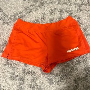 Hooters girl orange shorts